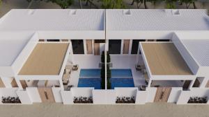 a model of a house with a swimming pool at The Sultanate Fulhadhoo Baa Atoll in Fulhadhoo +2 photos