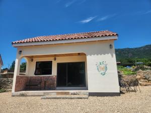 a small building with a mural on the side of it at Dara House Private Pension in Jangheung