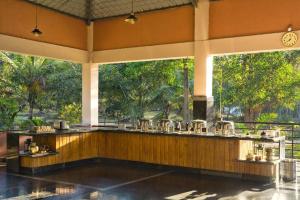 a bar in a resort with trees in the background at Green View Resorts in Munnar +13 photos