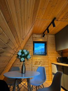 a room with a table and chairs and a window at Glamping baytik in Verkhnyaya Alaarcha