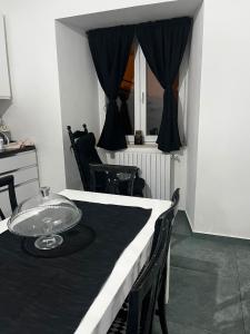 a dining table with a plate on top of it at La Casetta Noble House in Casoli