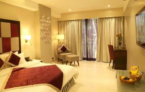The Flora Grand, Vasco, Goa客房内的一张或多张床位