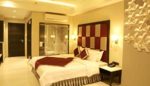 The Flora Grand, Vasco, Goa客房内的一张或多张床位