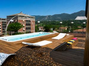 a swimming pool on the roof of a building at ZENIT Appartamenti & SPA in Terni
