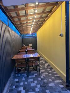 a row of tables and benches in a room at MANGO hotel in Zatoka
