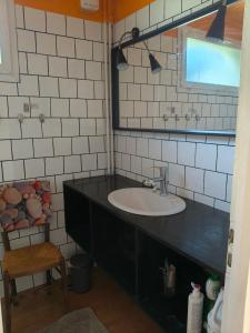 a bathroom with a sink and a mirror at Chambre d'hôte Mont mouton in Laferté-sur-Amance