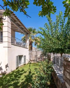 a view of the back yard of a villa at Harmony Hotel Apartments in Selianitika