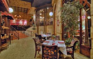 a restaurant with tables and chairs in a room at Eldorado Reno Hotel & Casino - A Caesars Rewards Destination in Reno