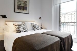 Posteľ alebo postele v izbe v ubytovaní Oteiza by FeelFree Rentals