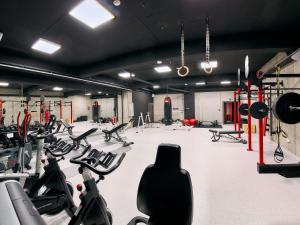 a gym with a lot of exercise equipment in it at ibis Styles Nowy Targ in Nowy Targ +159 photos