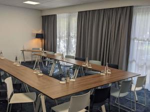 a conference room with a long table and chairs at Mercure Marseille Centre Bompard La Corniche in Marseille +132 photos
