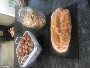 a table with two trays of bread and other foods at B&B Manoir Calmeer in Thenon +10 photos