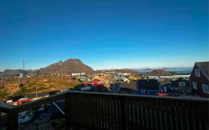 a view of a city from a balcony at Isi4u apartments, snowmobile and dogsled in Sisimiut