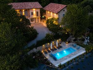 an aerial view of a house with a swimming pool at La Vita è Bella in Somano +40 photos