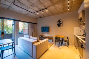 a living room with a couch and a table at BlackBrick Bedfordview ApartHotel in Johannesburg