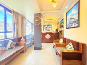 a waiting room with benches in a hospital at The Potola Hotel And Restaurant With Parking Facility in Darjeeling