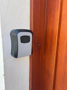 a black and white door knob on a wall at Apartmán 1, Heydukovka in Písek