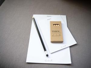 a notebook with a pen sitting on top of a penknife at Maek Hotel Antwerp Central - Accor Handwritten Collection in Antwerp +95 photos