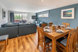 a living room with a table and a couch at 4 Bed in Winnards Perch oc-t29558 in Saint Columb Major