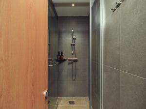 a bathroom with a shower with a glass door at Seoul ABC Hostel in Seoul +13 photos