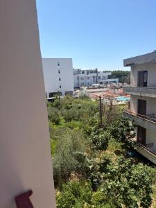 a view of a city from a building at Kodra Apartament in Golem