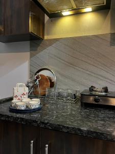 a kitchen counter with a tray of food on it at Couple friendly spacious 1BHK in Indore