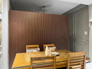 a dining room with a table and two chairs at Couple friendly spacious 1BHK in Indore