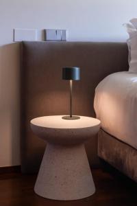 a small table next to a bed in a room at Stars View by Portugal Active in Fafe +141 photos