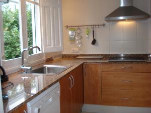 a kitchen with a sink and a counter top at CasasMontseny in Arbúcies +35 photos