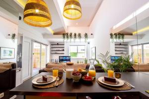 a living room with a table with food on it at PortugalActive Beach Flat in Viana do Castelo
