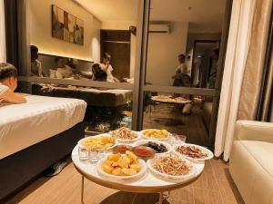 a table with plates of food on it in a room at Trang An Heritage Hotel in Nguyên Ngoại
