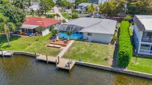 an aerial view of a house with a dock at Waterfront Pool Game Room Gulf Access in Cape Coral