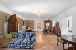a living room with a couch and a table at Fattoria San Pio in Naso