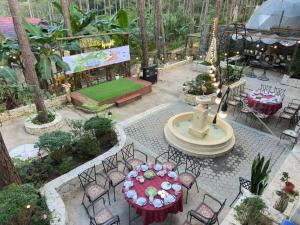 an overhead view of a garden with tables and chairs at De Vivre Café & Home in Kon Plong