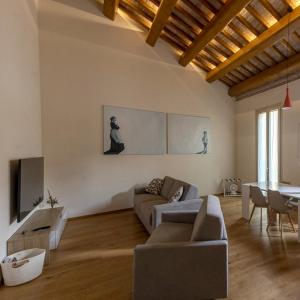 a living room with a couch and a table at Antica Corte Lugo in Lugo