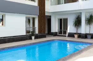 a swimming pool in front of a building at Bohemia palace in Hurghada