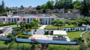 an aerial view of a house with a garden at Royal Luxury Villa by AKTIS VILLAS in Kriopigi