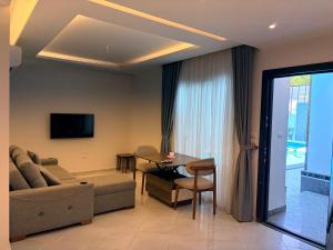 a living room with a couch and a table at Bohemia palace in Hurghada