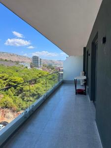 a balcony with a view of a city at Angelo Apartments Ilyonis Residence in Shëngjin