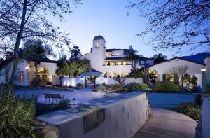 a large white house with a building at Ojai Valley Inn in Ojai