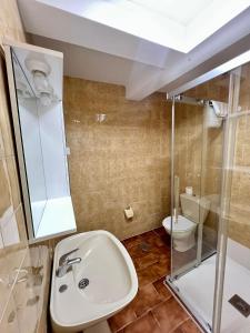 a bathroom with a sink and a toilet at La Xastra in Celorio +64 photos