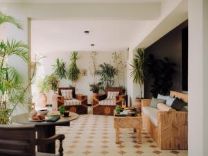 a living room with chairs and a couch at Longchamps l Zamalek l Boutique Hotel with Breakfast in Cairo