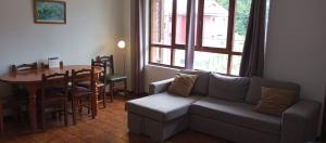 a living room with a couch and a table at La Xastra in Celorio