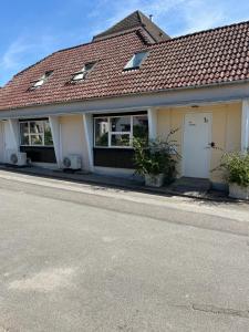 a house on the side of a street at The Apartment in Nordborg