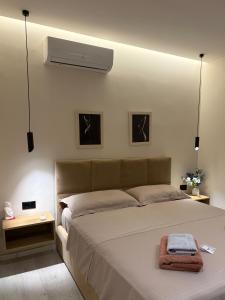 a bedroom with a bed with a white ceiling at Casa Tirana in Tirana