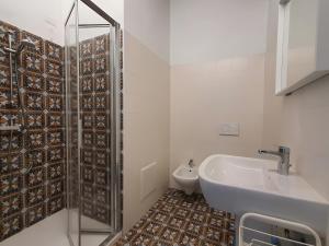 a bathroom with a shower and a sink and a toilet at La Cà de' mi Vecc in Fino Mornasco
