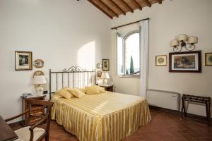 מיטה או מיטות בחדר ב-Castello di Fulignano
