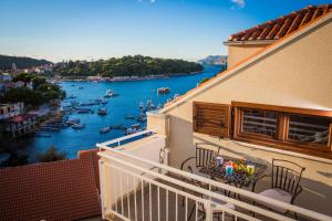 a balcony of a house with a view of a river at Apartment Bay view in Cavtat