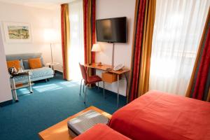 TV a/nebo společenská místnost v ubytování Design Hotel Zollamt