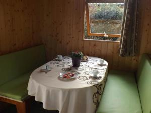 a table with a plate of fruit on it at CAMPING PLEIN SOLEIL in Lourdes +47 photos